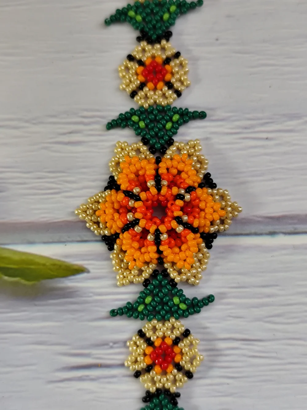 Vibrant Orange Floral Seed Bead Bracelet with Gold & Green Accents